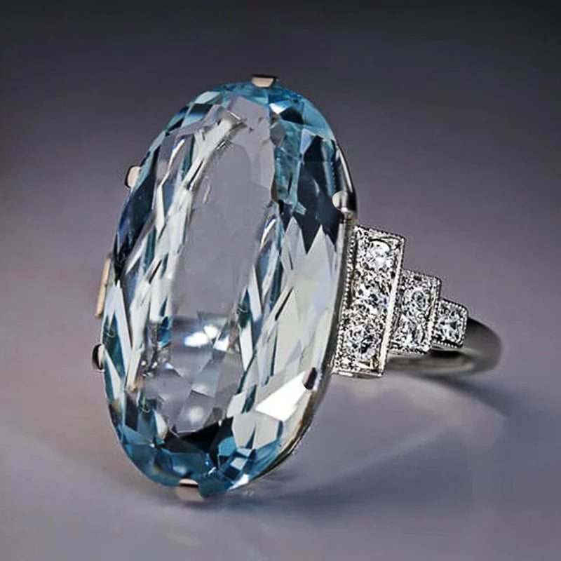 Huitan Oval Sky Blue CZ Women's Wedding Band Ring | Bridal Women's Fashion Ring Axl SKY BLUE Silver Plated 9
