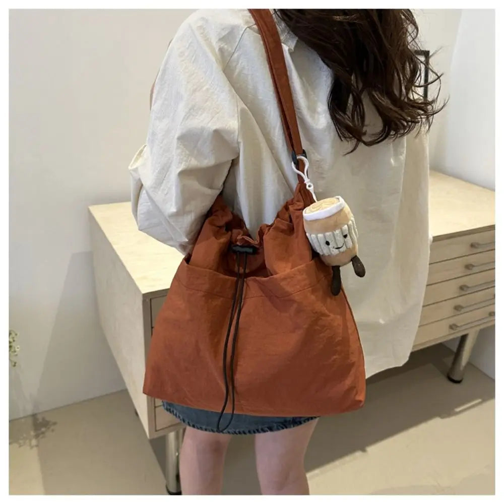 Women's Nylon Drawstring Tote – Waterproof Crossbody Bucket Bag Drawstring Bucket Bag Axl orange-with pendant