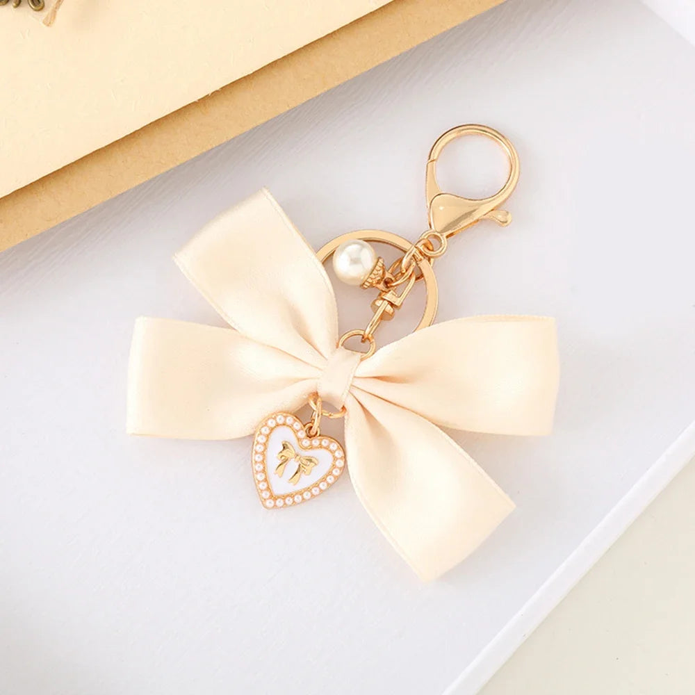 Imitation Pearl Keychain Ribbon Bowknot Bag Charm for Women Fashion Keychain Axl apricot 1pc